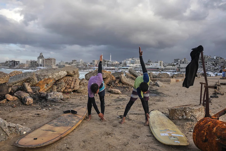 Against the Odds: Surfers Ride Waves Along Gaza City's War-Damaged Shoreline