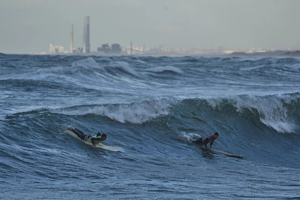 Against the Odds: Surfers Ride Waves Along Gaza City's War-Damaged Shoreline