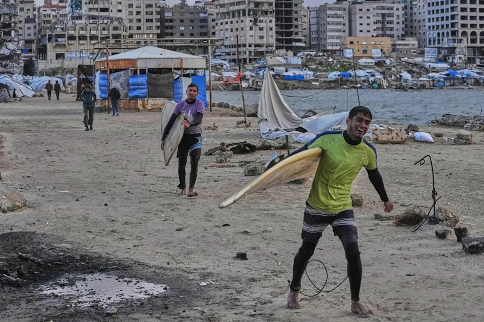 Against the Odds: Surfers Ride Waves Along Gaza City's War-Damaged Shoreline