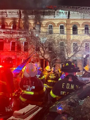 Five‑Alarm Bronx Blaze Injures Six — Firefighter Struck by Falling AC; Nearly 30 Families Displaced