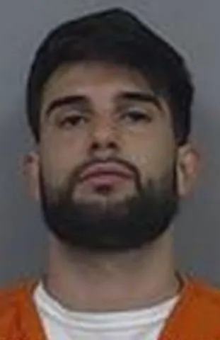 Passenger Who Tried to Open Plane Exit Mid-Flight, Threatened Crew, Sentenced to 18 Months