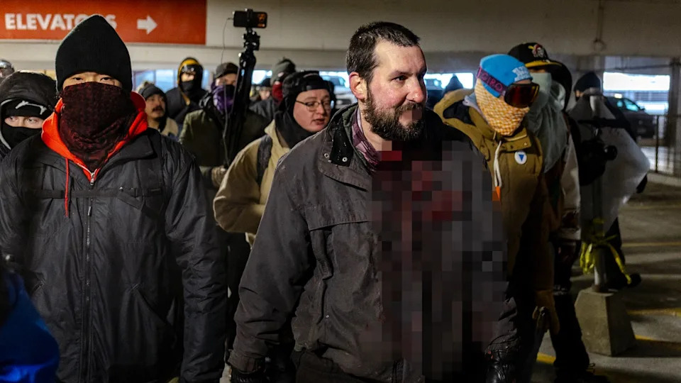 Video Shows Man Allegedly Assaulted With Flagpole by Anti‑ICE Protesters in Minneapolis Parking Garage