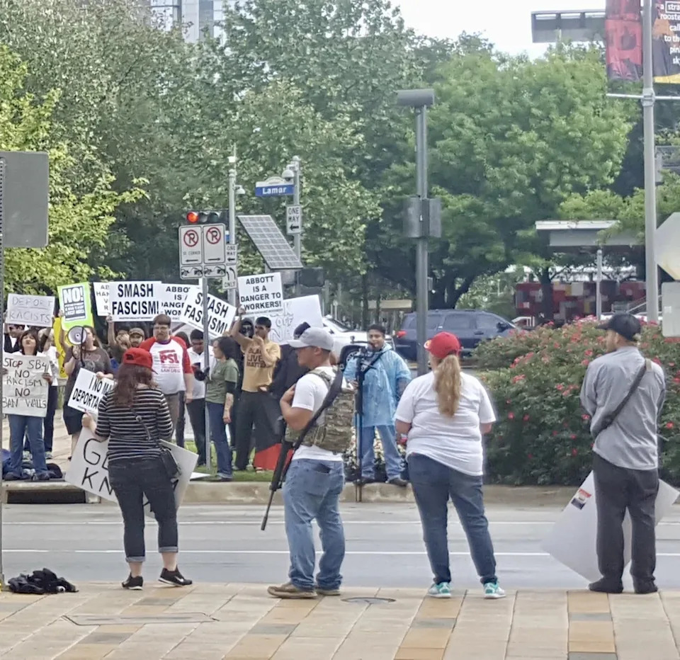 Viral Photo Of Armed MAGA Protesters Fuels Scrutiny After Alex Pretti Shooting
