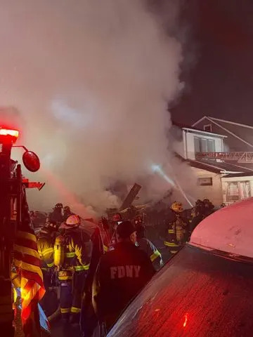 Queens House Explosion Tosses Seven NYPD Officers; Suspect Missing as Fire Displaces 16