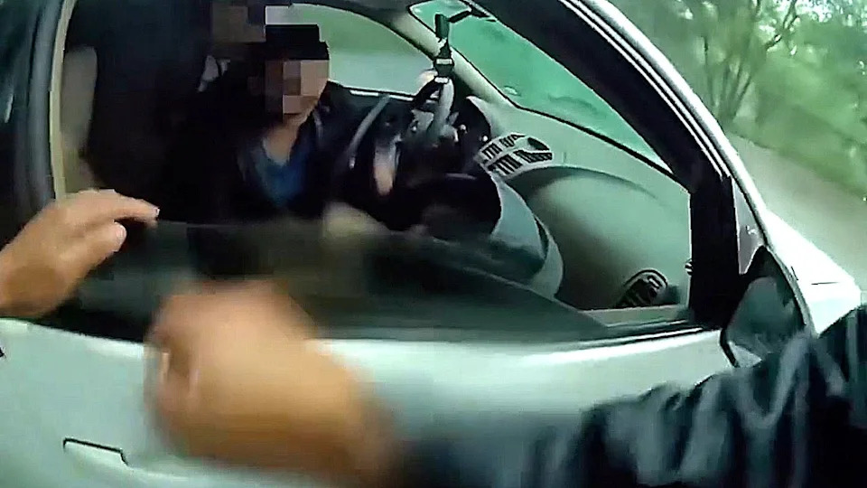 Body-Cam Shows Dramatic Rescue Of Baby From Car Swept By Floodwaters In Beeville, Texas