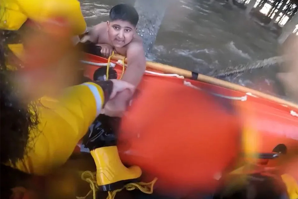 Helmet-Cam Footage Shows RNLI Lifeboat Rescue Two Boys Trapped Under Blackpool Pier During Surging Tide