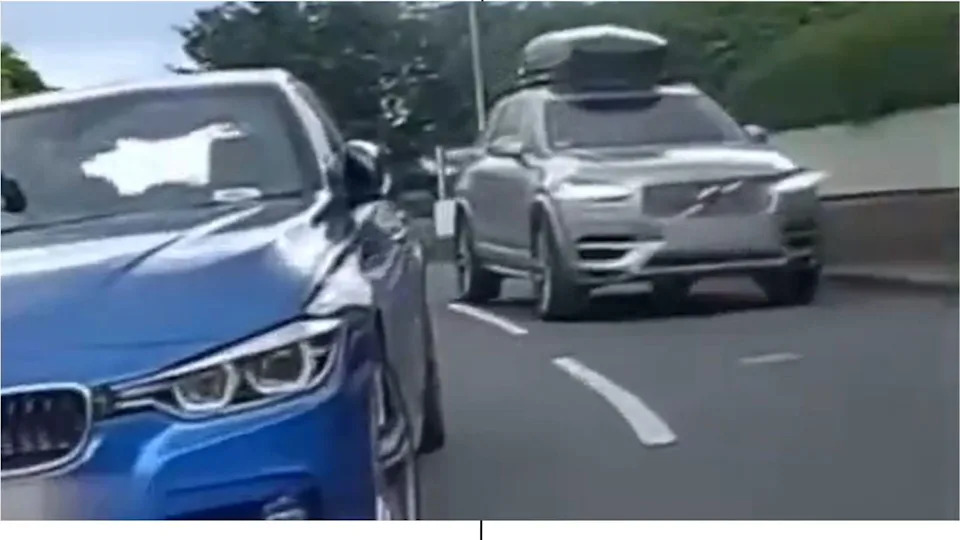 Cyclist Fined £1,200 After Helmet-Cam Reveals Risky Move Between Parked Car and SUV