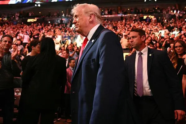 Fact Check: Viral Clips Show A Man Behind Trump Reacting At Lindsey Graham’s Funeral — No Evidence Of A Diaper Or Flatulence