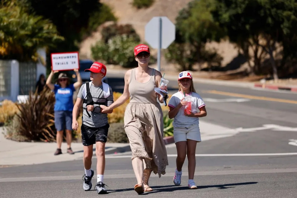 Mother Urges Son To Flip Off MAGA Supporters, Shouts Graphic Accusations Ahead Of Trump’s LA Visit