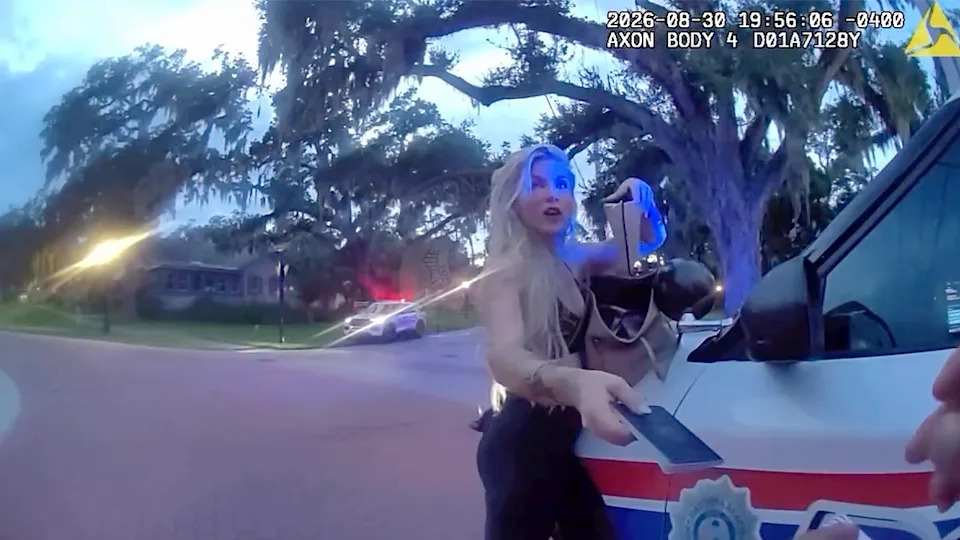 Daytona Beach Bodycam Shows Woman Downplay SUV Plow Into Parked Car, Pleads With Officers