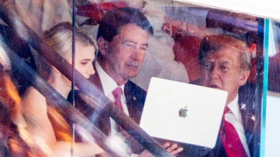 Natalie Harp Draws Attention as Trump Leans Over Her Laptop at Neyland Stadium