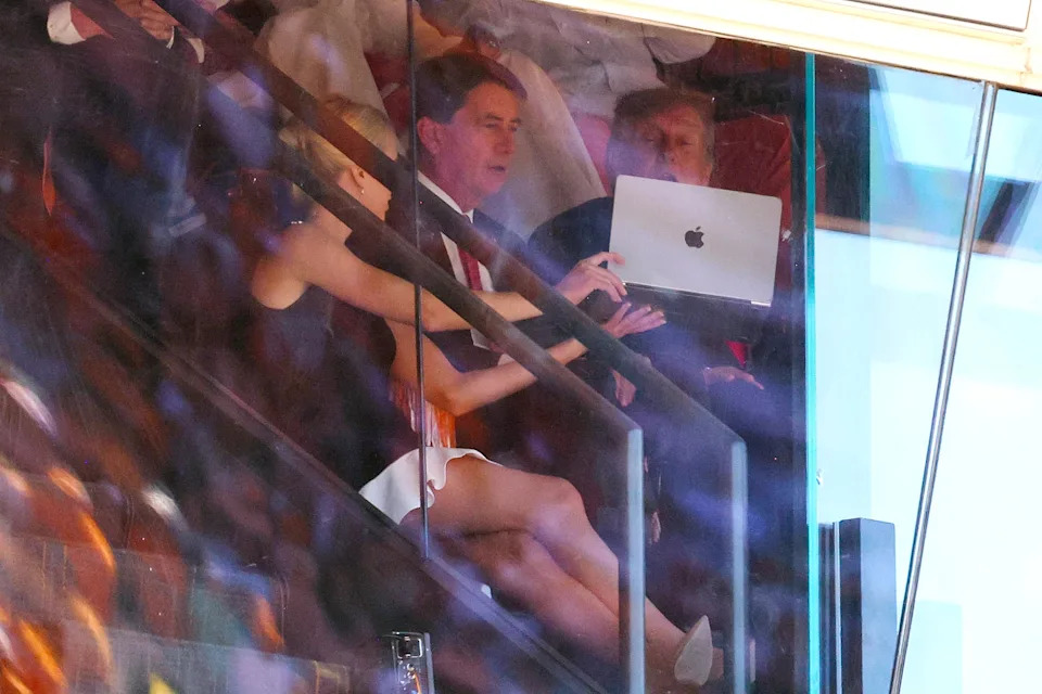 Natalie Harp Draws Attention as Trump Leans Over Her Laptop at Neyland Stadium